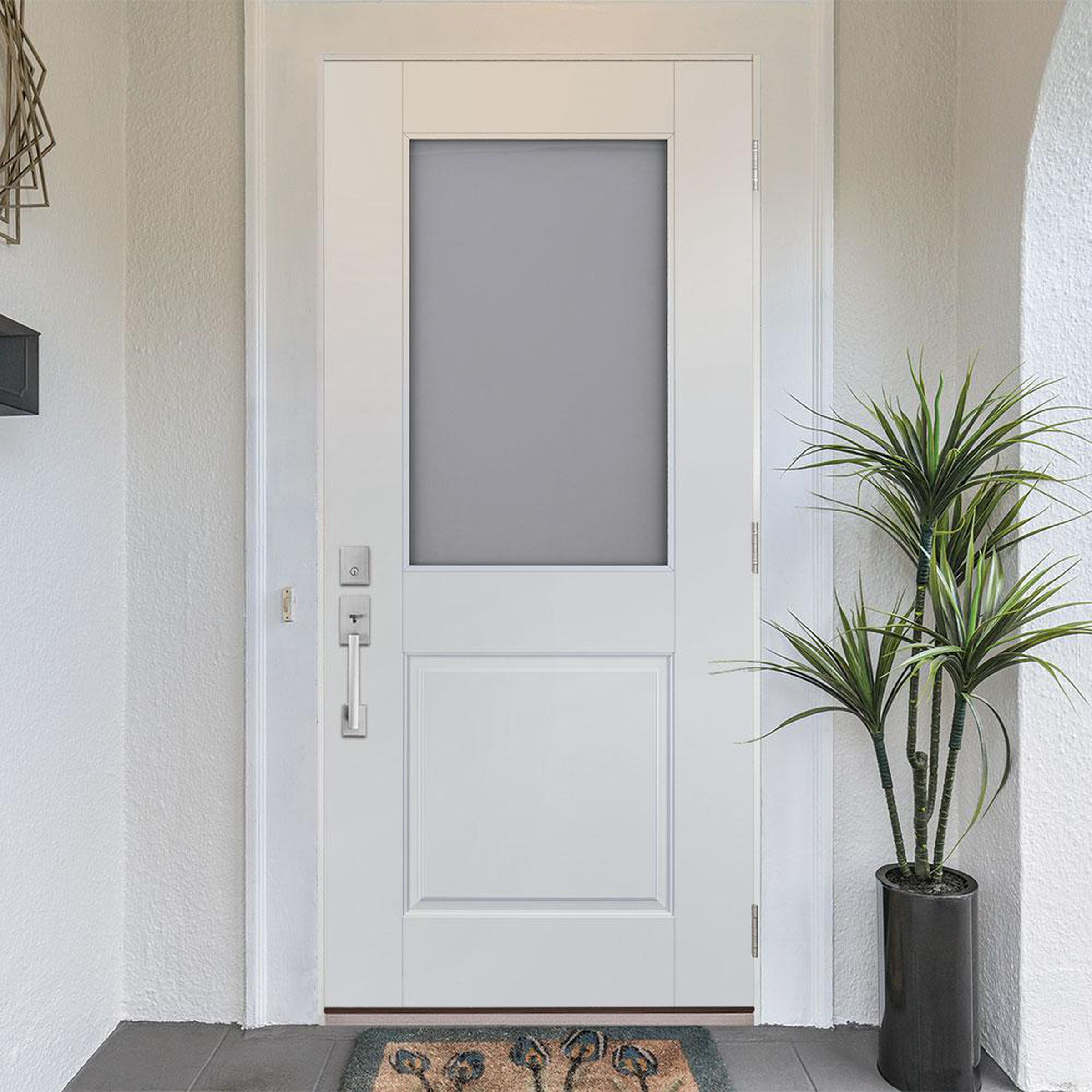 The smart glass door with the half lite glass. It doesn’t come with a door lock or handle; you need to supply your own.